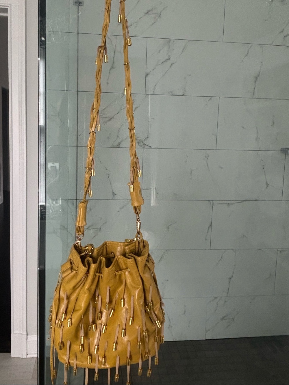 Remi and Reid Crossbody bucket bag with tassels